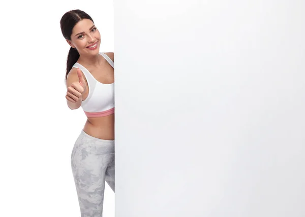 Attractive Gym Girl Makes Sign While Holding Billboard She Standing — Stock Photo, Image