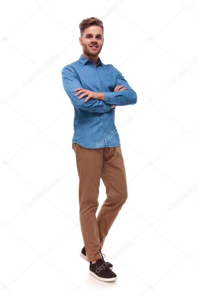 handsome casual man standing on white background with arms crossed, full body picture