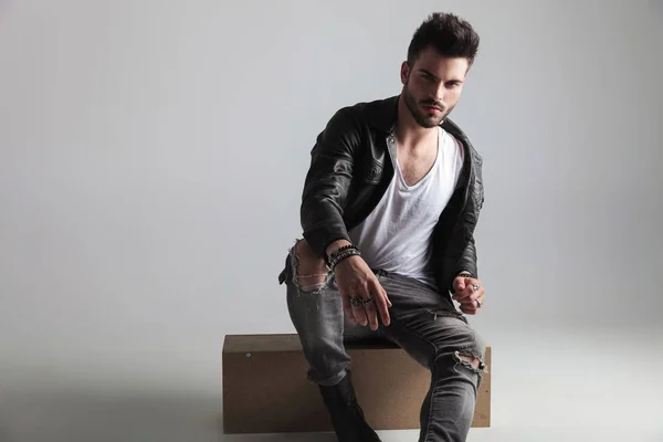 Sexy Man Wearing Leather Jacket Grey Jeans Sitting Wooden Crate — Stock Photo, Image