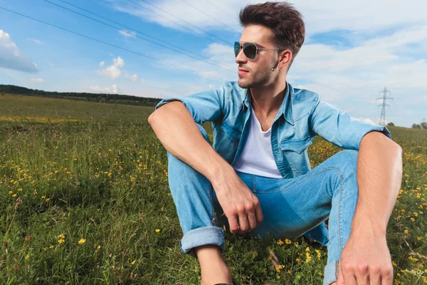 Seated Casual Man Sunglasses Undone Denim Shirt Admires Nature While — Stock Photo, Image