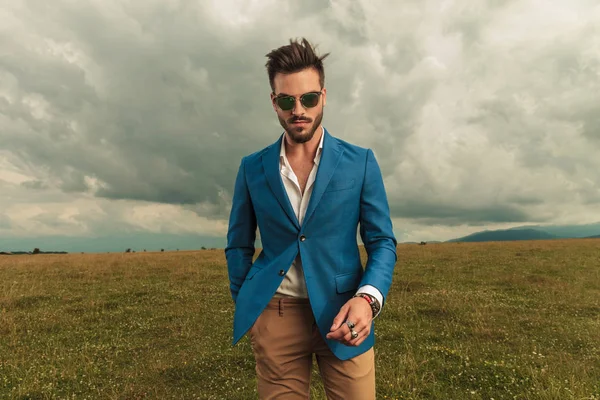 Relaxed Man Wearing Sunglasses Blue Suit Standing Field Clouds Sky — Stock Photo, Image