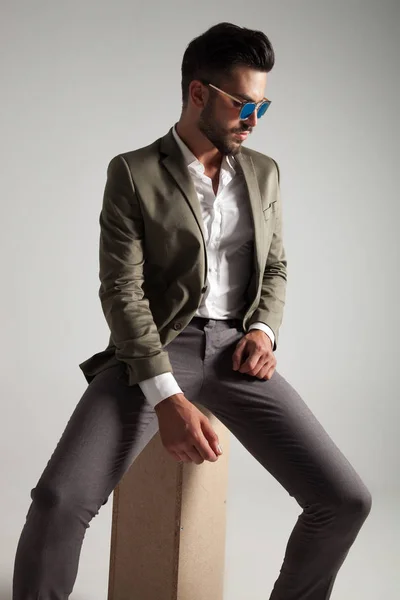 Elegant Man Wearing Green Suit Sunglasses Looks Side While Sitting — Stock Photo, Image