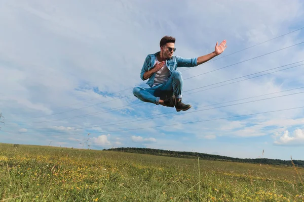 Young Fighter Sunglasses Jumps Field Attack Kick — Stock Photo, Image