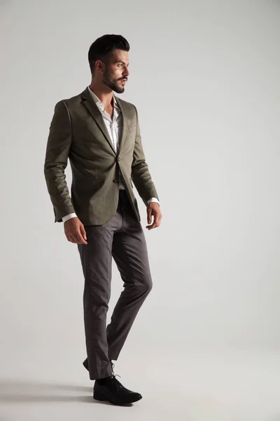 Elegant Man Grey Suit Stands Light Grey Background Looks Side — Stock Photo, Image