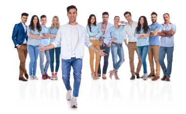 casual group leader welcomes you with open hands in his team while standing on white background, full body picture clipart