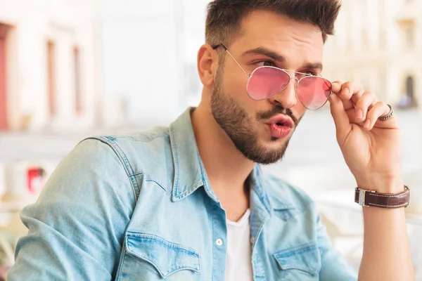 Portrait Seated Astound Man Fixing Sunglasses Looking Side While Sitting — Stock Photo, Image