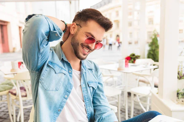 Smiling Man Sunglasses Sitting City Cafe Looking While Holding His — Stock Photo, Image