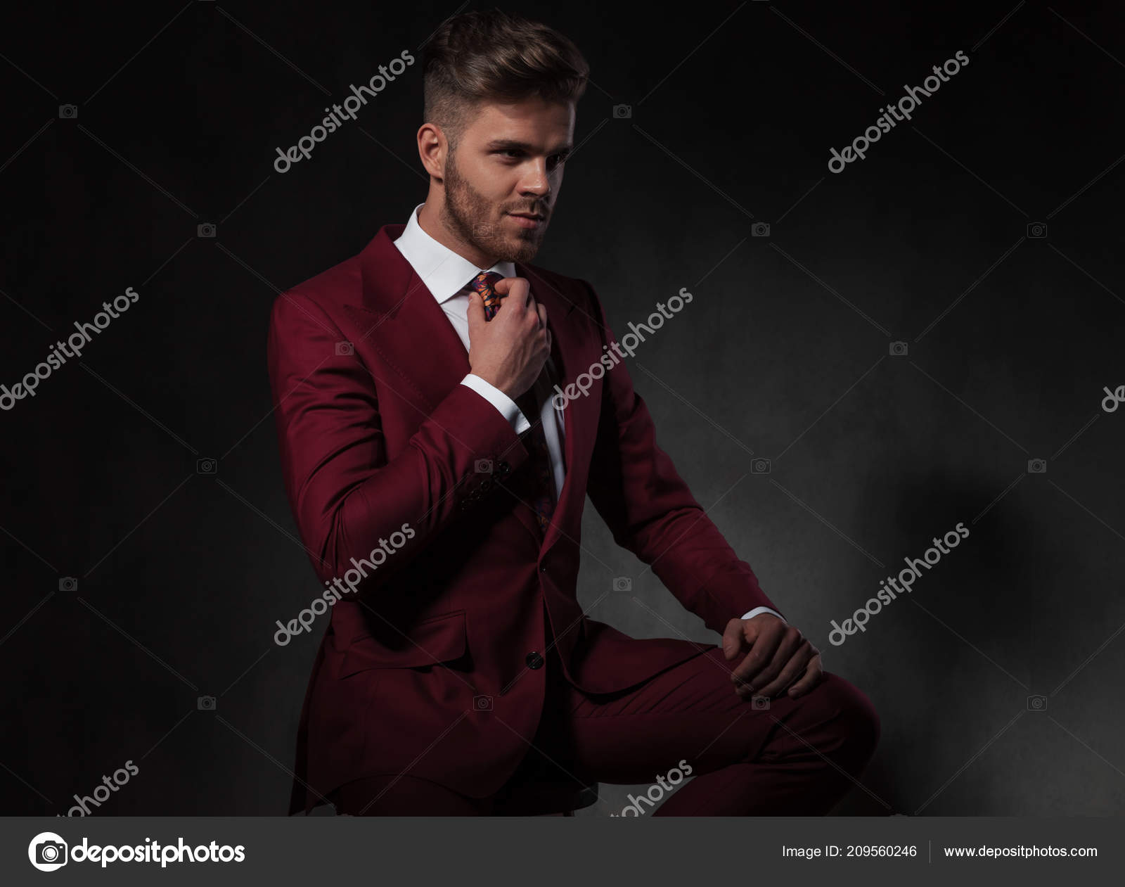 Suit And Tie Wallpaper Gentleman Suit Fixing His Red Tie Looking