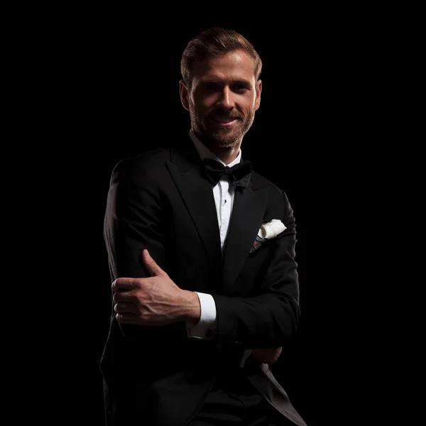 Young Smiling Man Tuxedo Sitting Hands Crossed Black Background — Stock Photo, Image