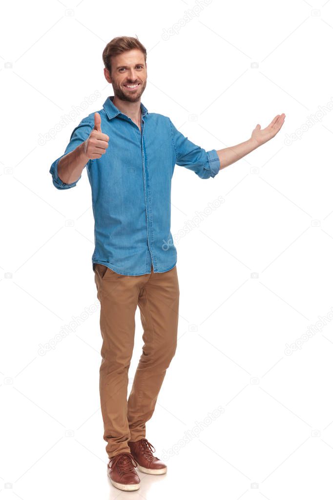 full body picture of a casual man presenting and making the ok sign on white background