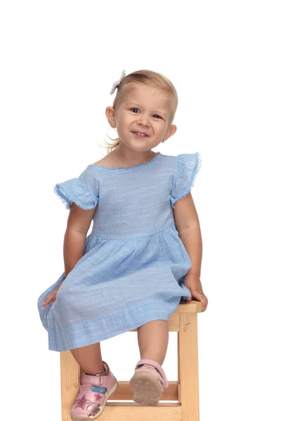 Adorable Little Girl Blue Dress Laughing Sitting Wooden Chair White — Stock Photo, Image