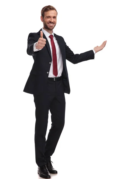 Joyful Businessman Invites Makes Thumbs Sign While Standing White Background — Stock Photo, Image
