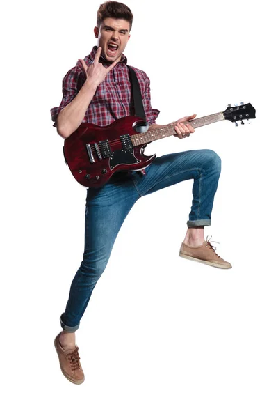 Excited Guitarist Jumping Making Rock Sign Concert White Background While — Stock Photo, Image