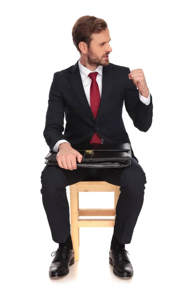 Businessman Celebrating Fist Air Looks Side While Sitting Wooden Chair — Stock Photo, Image