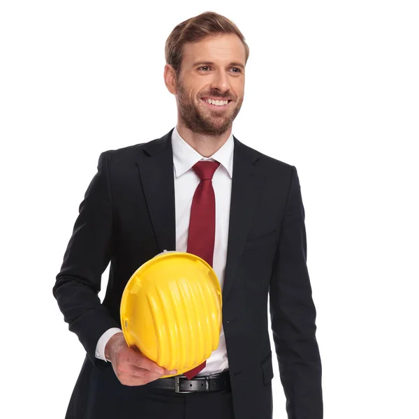 Portrait Businessman Holding Engineer Helmet Smiling Looking Side While Standing — Stock Photo, Image
