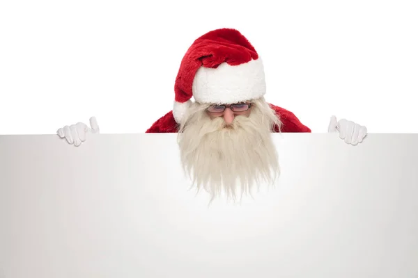 Portrait Santa Claus Looking White Board While Standing White Background — Stock Photo, Image