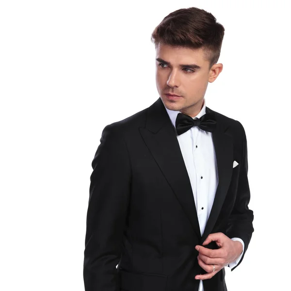 Portrait Curious Businessman Bowtie Unbuttoning His Black Suit While Looking — Stock Photo, Image