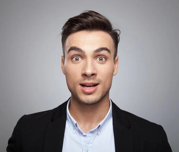 Portrait Shocked Smart Casual Black Suit Man Standing Light Grey — Stock Photo, Image