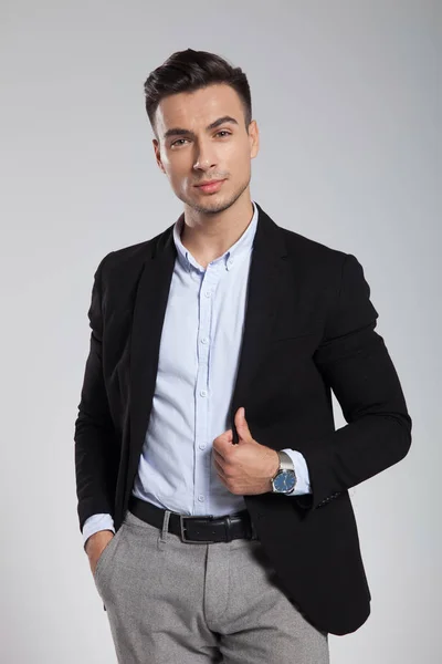 Portrait Relaxed Young Businessman Holding Black Suit Collar While Standing — Stock Photo, Image