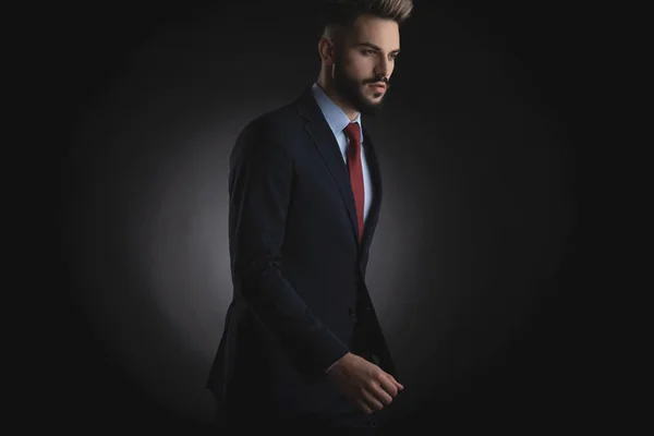 Portrait Handsome Businessman Navy Suit Walking Side Black Background — Stock Photo, Image