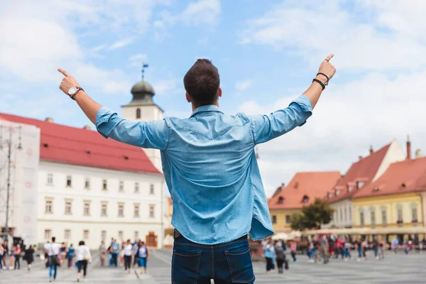 Back View Casual Man Celebrating Hands Air Pointing Fingers While — Stock Photo, Image