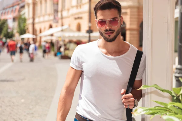 Portrait Handsome Young Man Holding Shoulder Bag Wearing Sunglasses While — Stock Photo, Image