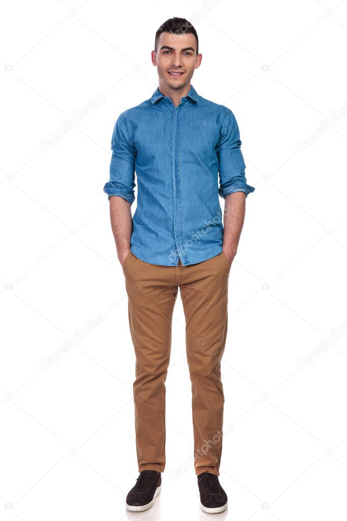 relaxed casual man standing with hands in pockets on white background, full body picture