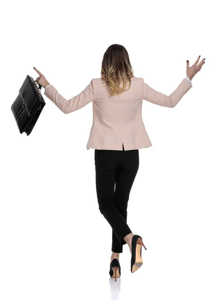 Back View Smart Casual Woman Holding Suitcase Greeting Someone While — Stock Photo, Image
