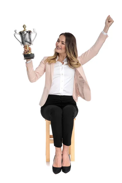 Happy Businesswoman Looks Trophy Side Celebrates Hand Air While Sitting — Stock Photo, Image