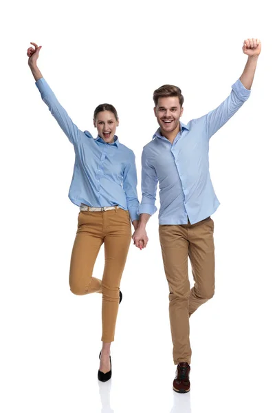 Winning Young Casual Couple Hands Air Walking White Background — Stock Photo, Image