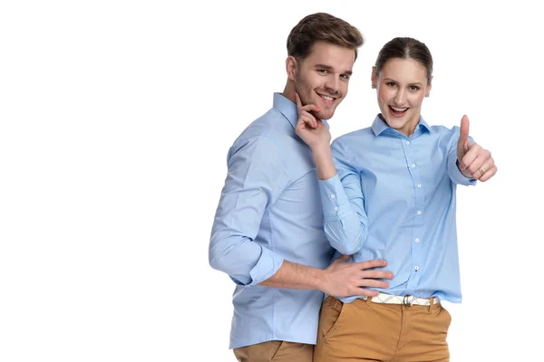 Embraced Happy Casual Couple Woman Makes Sign White Background — Stock Photo, Image