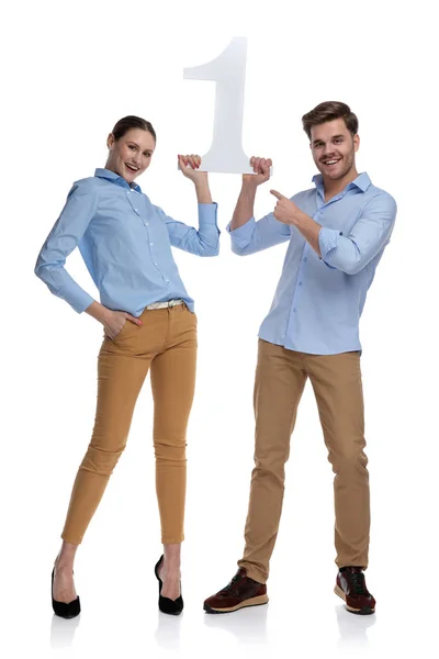 Young Casual Man Woman Holding Number One Man Pointing Finger — Stock Photo, Image