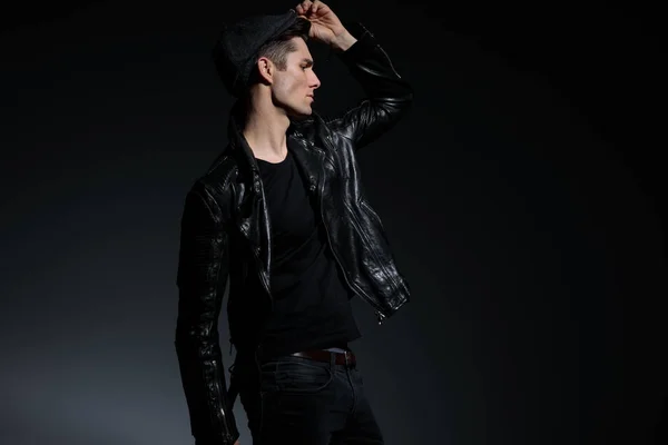 Young man in leather jacket look far away to side — Stock Photo, Image