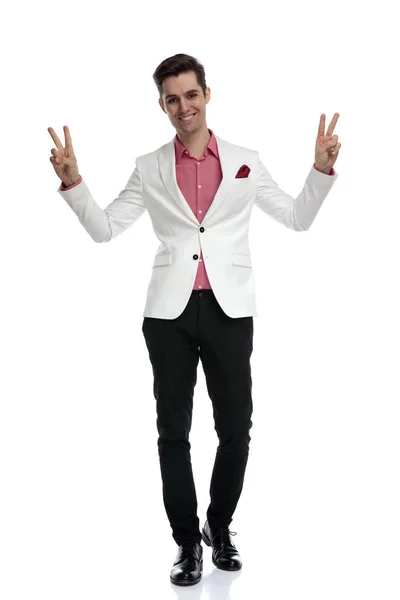 Happy young businessman making victory gesture with both hands — Stock Photo, Image