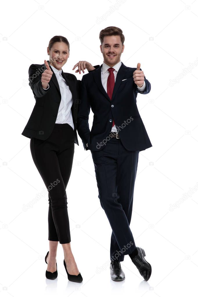 couple in business suits liking with thumbs up