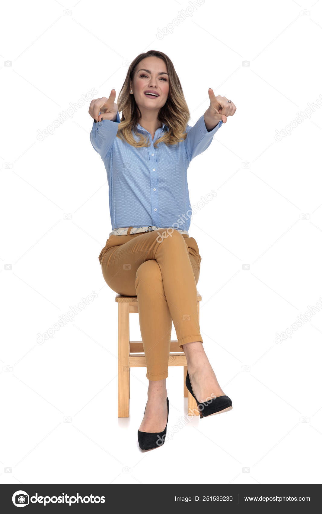 Full body picture of a young casual woman presenting Stock Photo