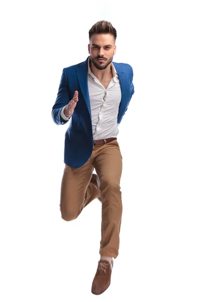 Fashion man in suit sprinting fast — Stock Photo, Image