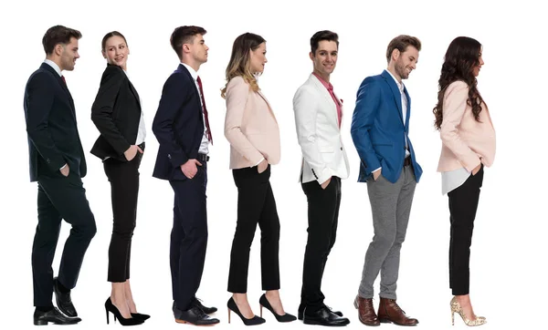 Young happy business people standing and waiting in line — Stock Photo, Image