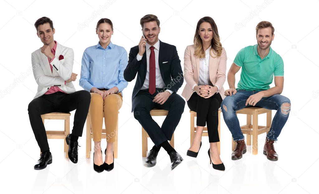 happy group of people waiting for a job interview 