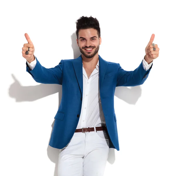 Happy young man giving a double thumbs up — Stock Photo, Image