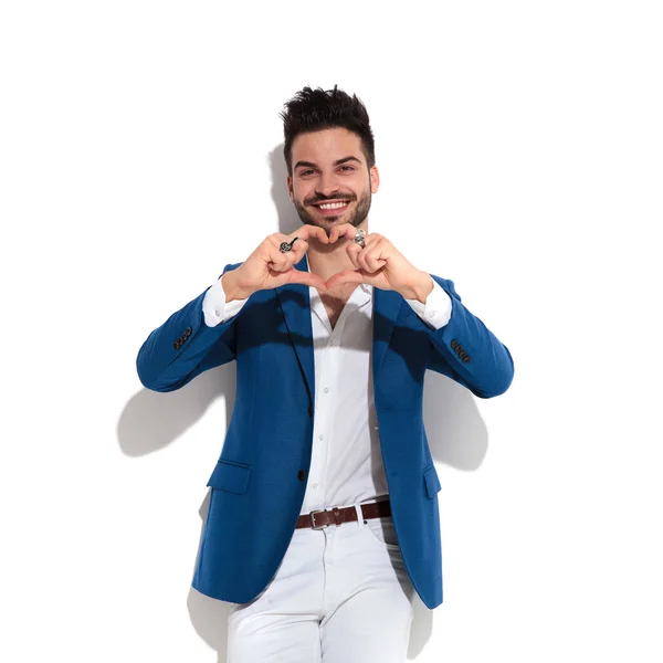 Lovely guy holding his hands to form a heart — Stock Photo, Image