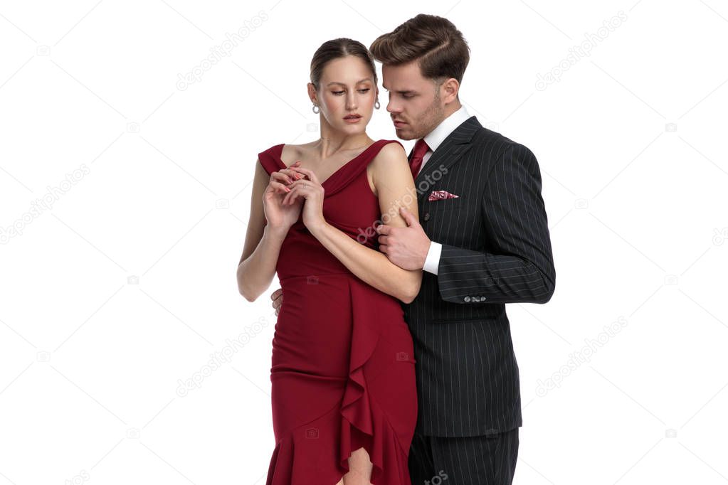 Romantic man comforting his thoughtful girlfriend