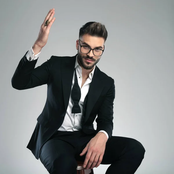 Casual guy gesturing with his hand in the air — Stock Photo, Image