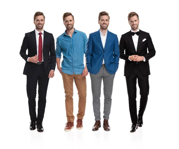 Homme élégant posant avec quatre styles de vêtements différents — Photo