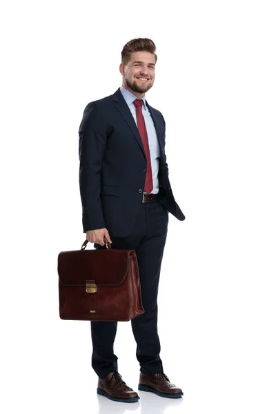 Positive businessman holding his briefcase — Stock Photo, Image