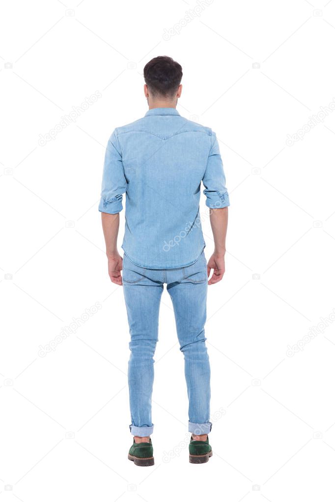 back view of young man wearing denim