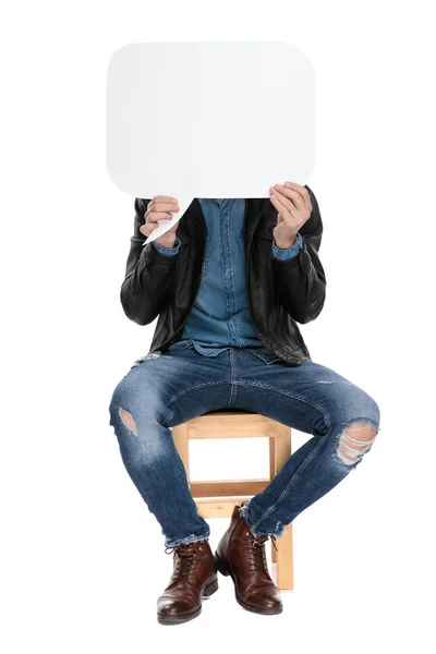 Man sitting with face covered by speech bubble — Stock Photo, Image