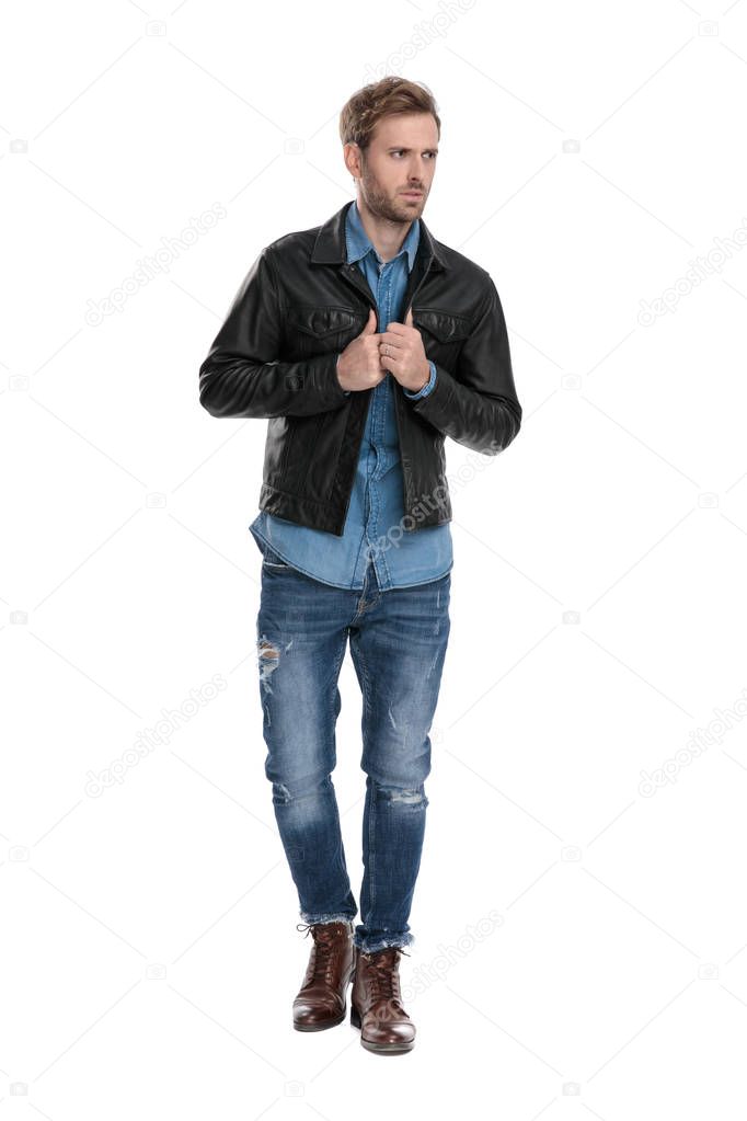 man adjusting his jacket anxious