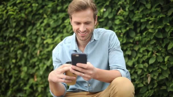 Young Casual Man Taking Coffee Break Read His Phone — Stock Video
