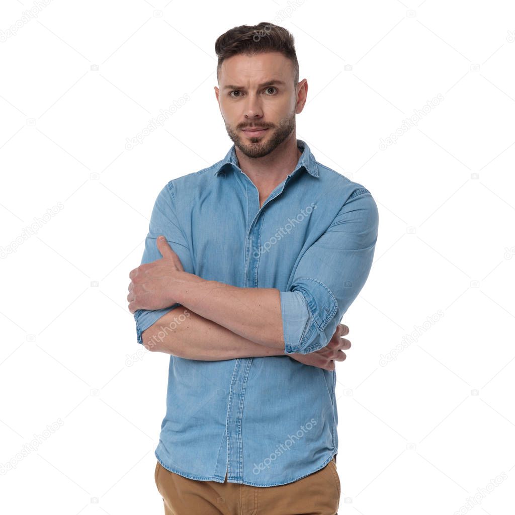 casual man standing with arms crossed badass